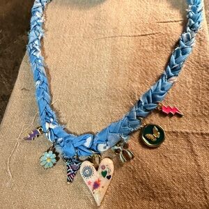 Brand new. Never worn. Handmade Blue Braided Necklace with Charms